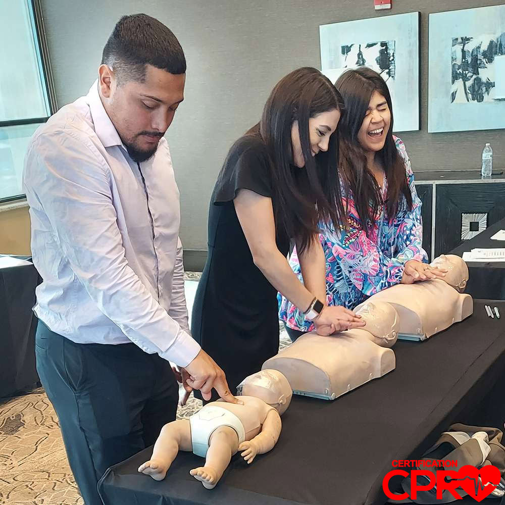CPR training class in Denver with students practicing on mannequins.